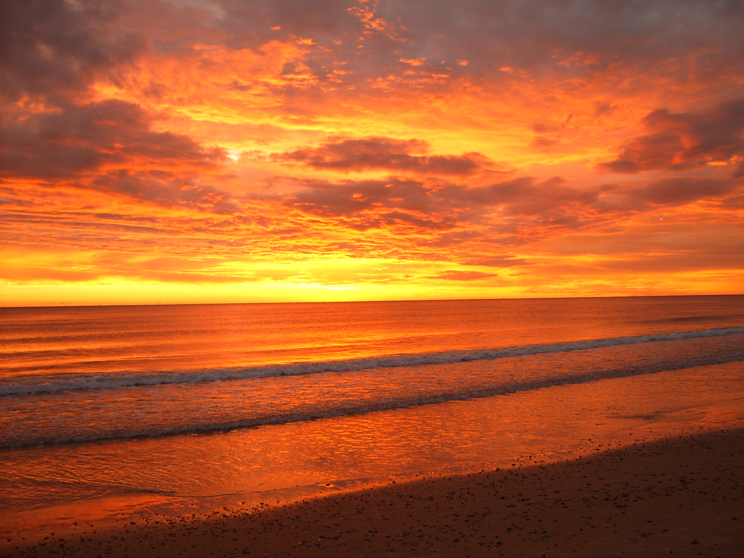 Piriapolis Beach under a Red Sky by AF - Desktop Wallpaper